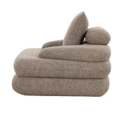 Tijdloze luxe handgemaakte loungestoel in zandkleurig bouclé-design