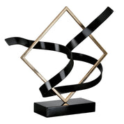 Swing of balance black and gold metal sculpture