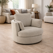 Beige armchair in a living room with tiled floor and neutral decor