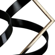 Swing of balance black and gold metal sculpture