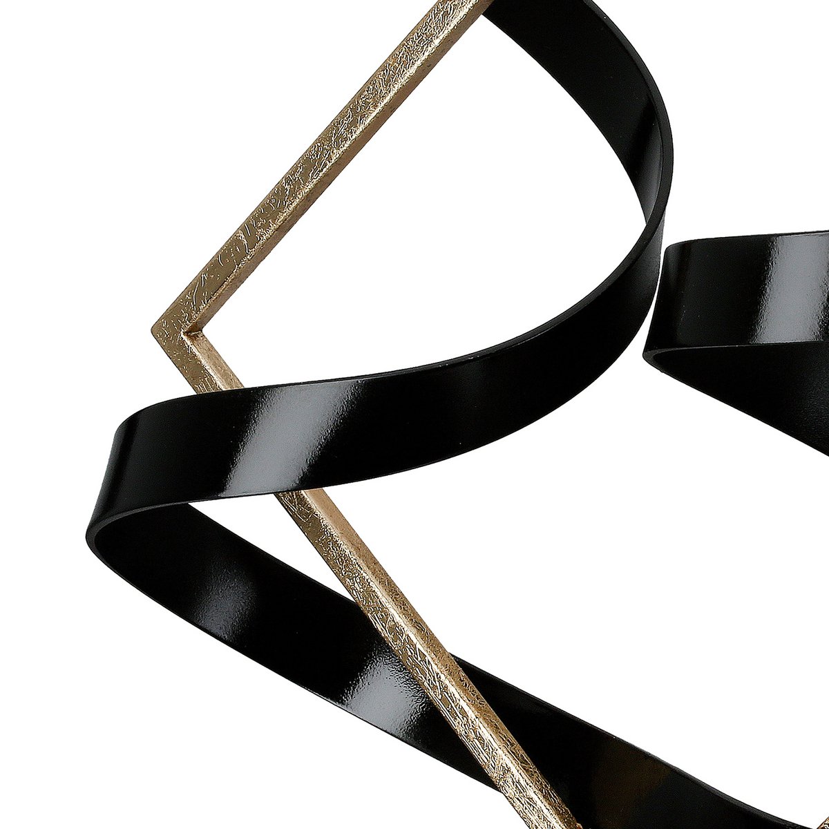Swing of balance black and gold metal sculpture