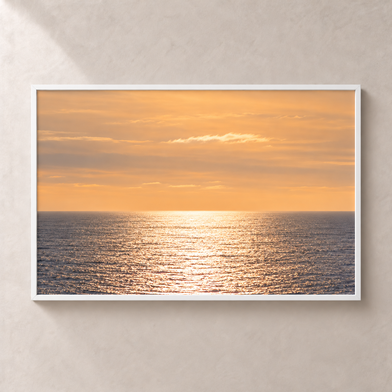 Sea in Soft Silver horizontal poster in a white frame, front view on a warm neutral wall